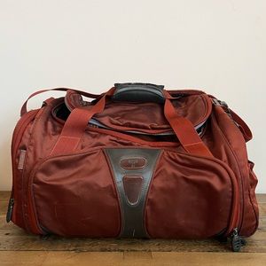 Tumi t-tech duffle in burnt orange